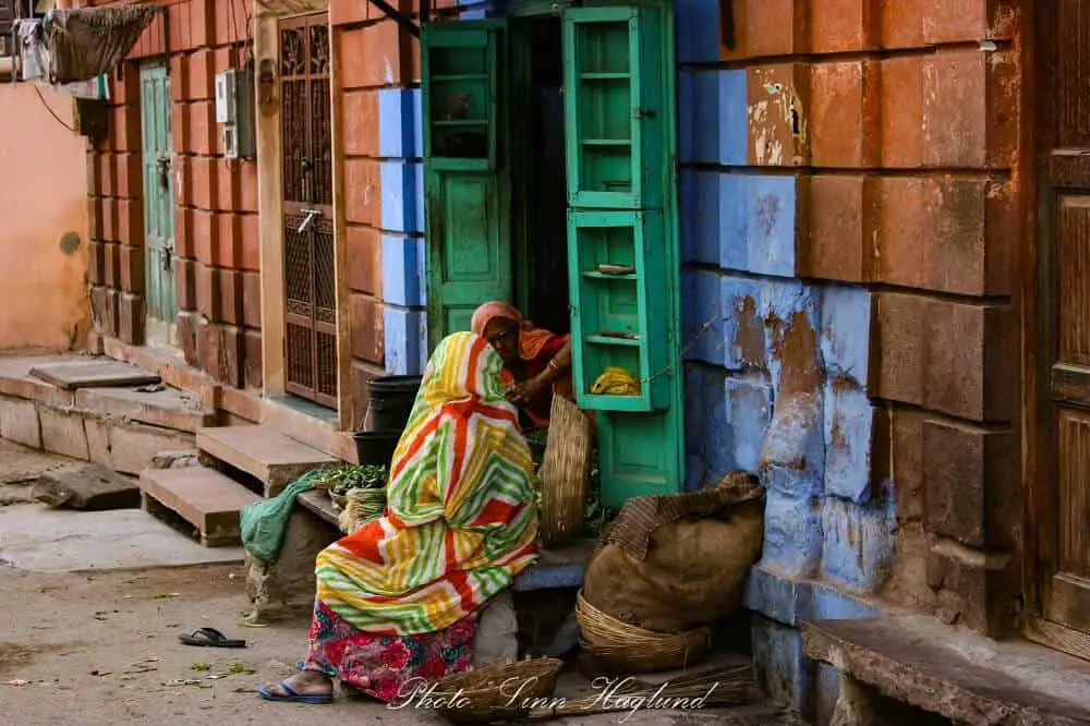 Two indian women chatting outside their door in Jodhpur, India