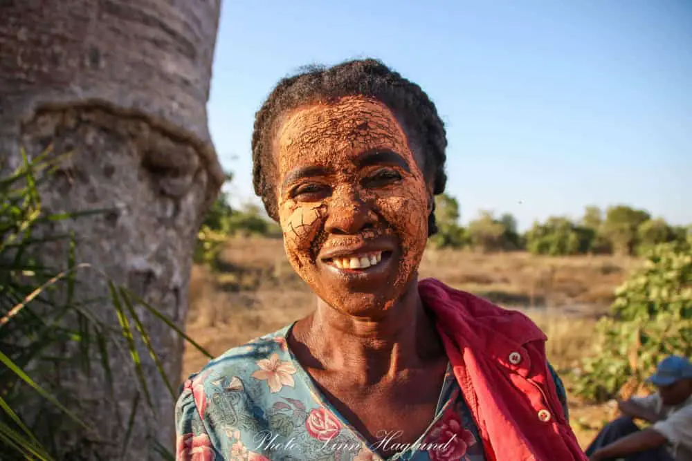 Malagasy woman with clay in her face to protect her skin from the sun