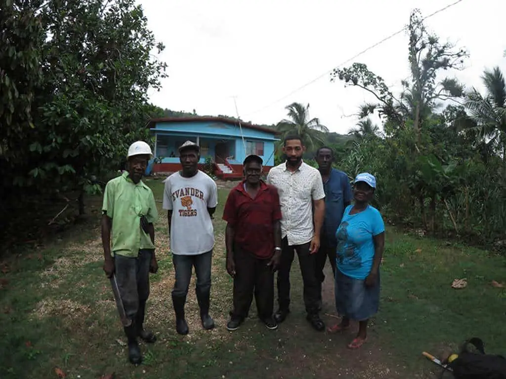 Daniel with a local family in Jamaica