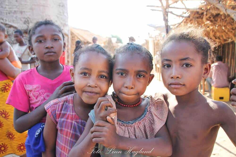 Girls in Madagascar that wanted to be photographed. their mothers are standing ringht next to them.