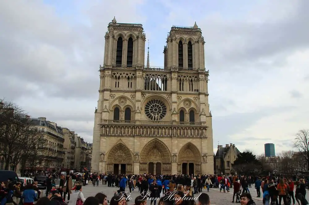 Notre Dame in Paris is crowded with tourists and queues to go inside are extremely long 