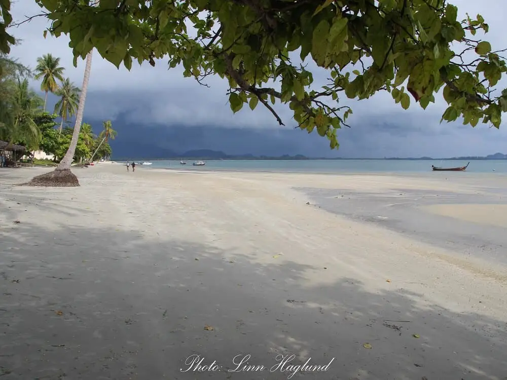 Thailand off the beaten track - Long white beack at Koh Mook with a thunder storm getting closer