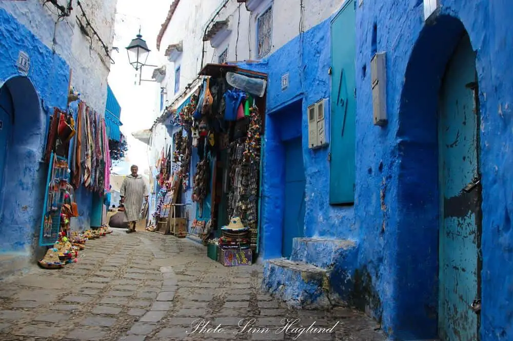 A local walking down one of the tiny streets of the medina