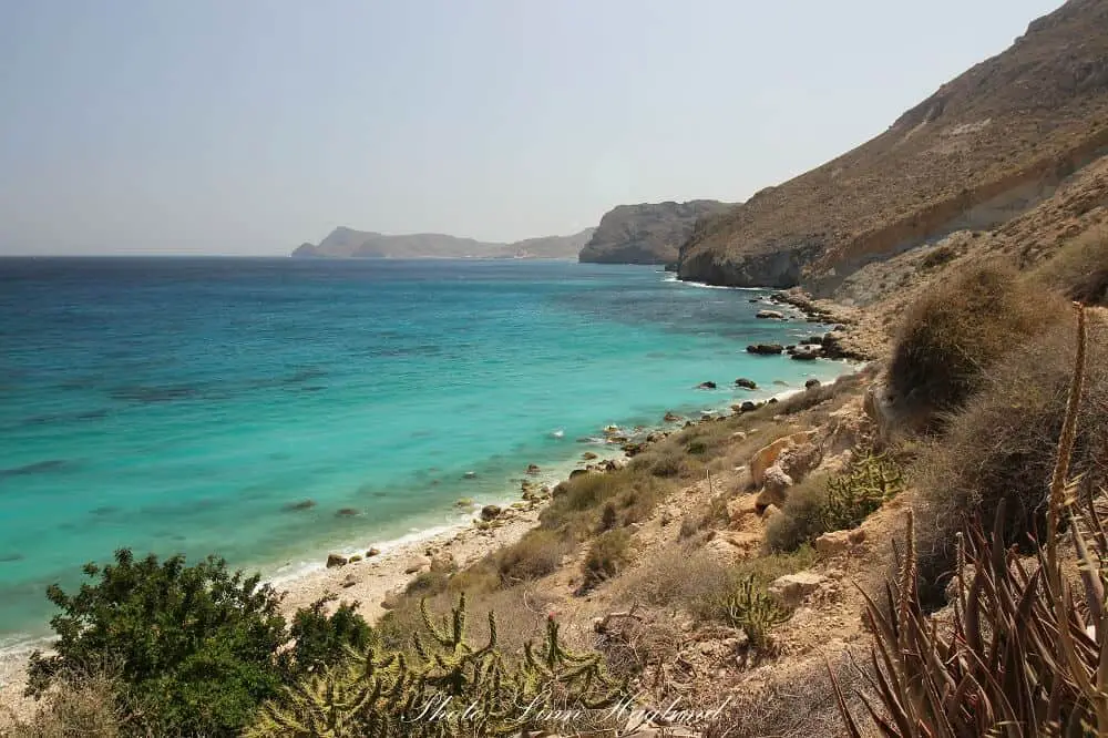 The rocky side of the beach in Cala de San Pedro