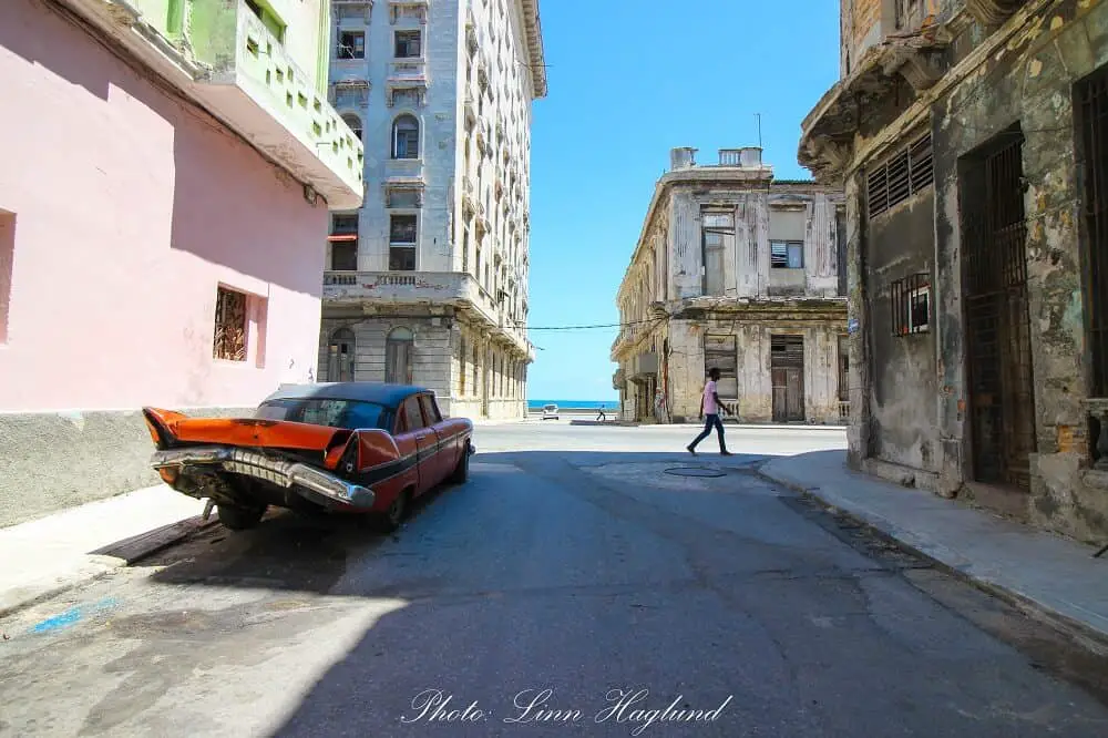 A crashed vintage car in the streets of Havana