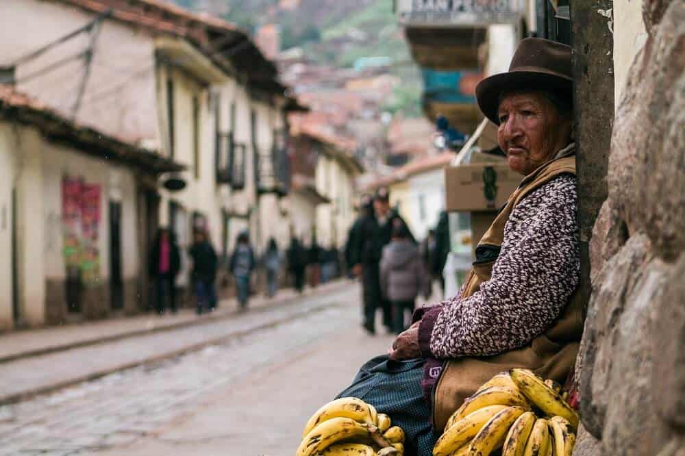 Woman selling bananas. Photo by Peter Hershey - Unsplash