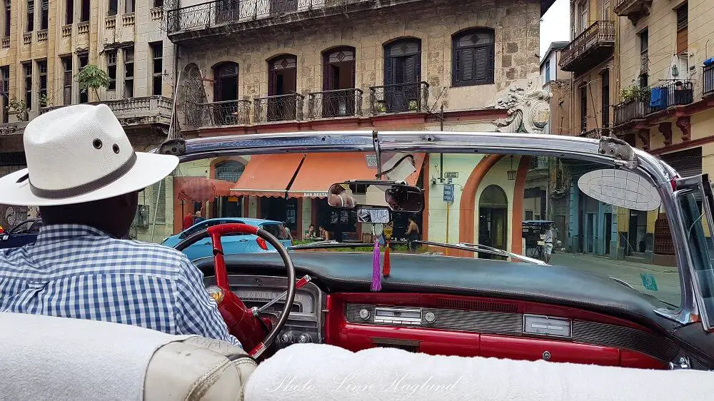 A vintage taxi tour in Havana is a good way to support the locals