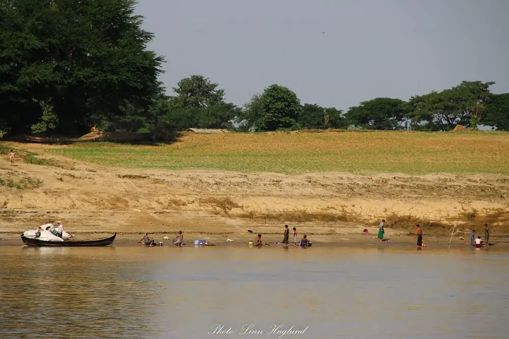 Locals in Irrawaddy River seen from the boat from Bagan to Mandalay