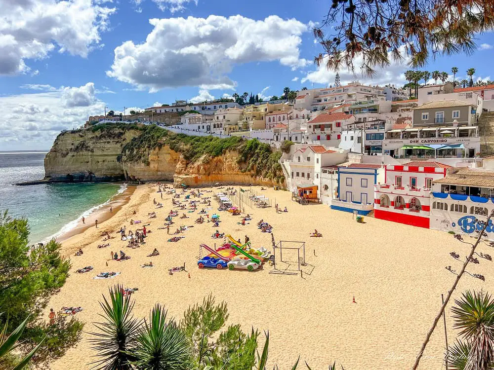 Views of the beach and colorful houses in Carvoeiro Algarve Portugal.