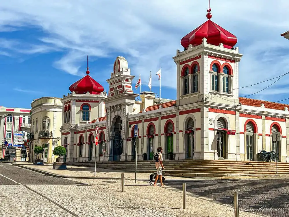 Loulé Food market with red domes topping the towers on the corners of the building.