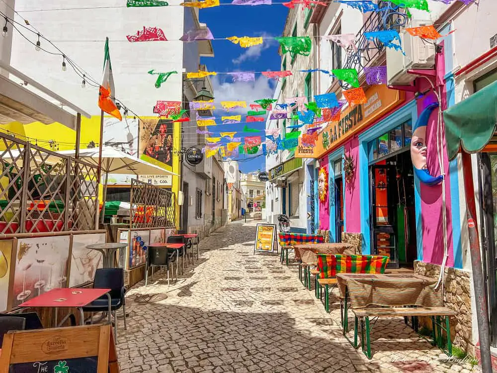 A colorful alley with restaurants in Alvor Portugal.