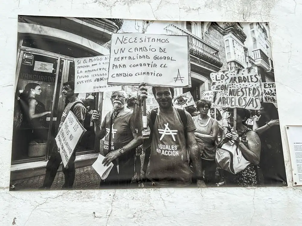 A black and white photo of people protesting for climate change as part of a climate change campaign in Cadiz Spain.
