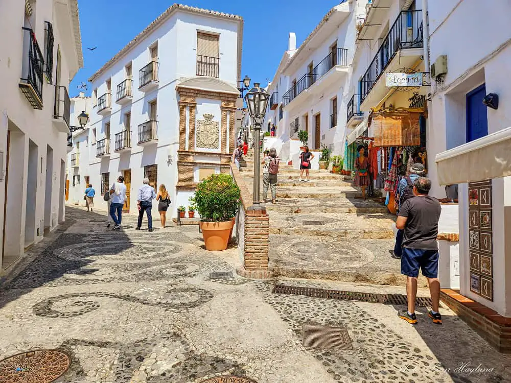 A beautiful, steep street in Frigiliana, which is one of the most beautiful white villages near Malaga Spain.