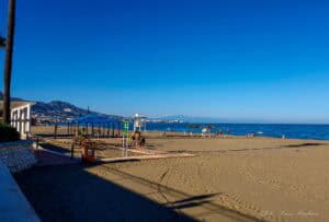 People walking on a beach, which is one of the best things to do in Fuengirola Spain.