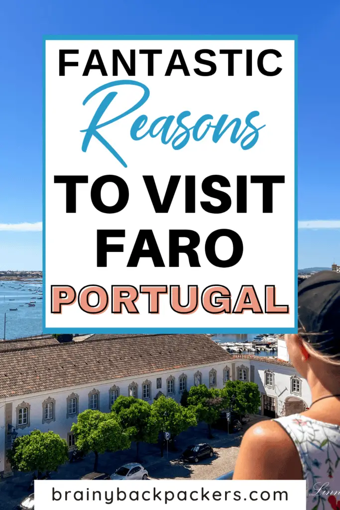 Me, wearing a flowery summer dress and a cap, looking out on the marina in Faro and Ria Formosa Natural Park from Faro's Cathedral rooftop, with the overlay text: "Is Faro Worth visiting?"