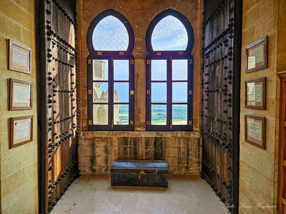 Views out of medieval windows in Almodovar Castle of one of the towers and countryside views