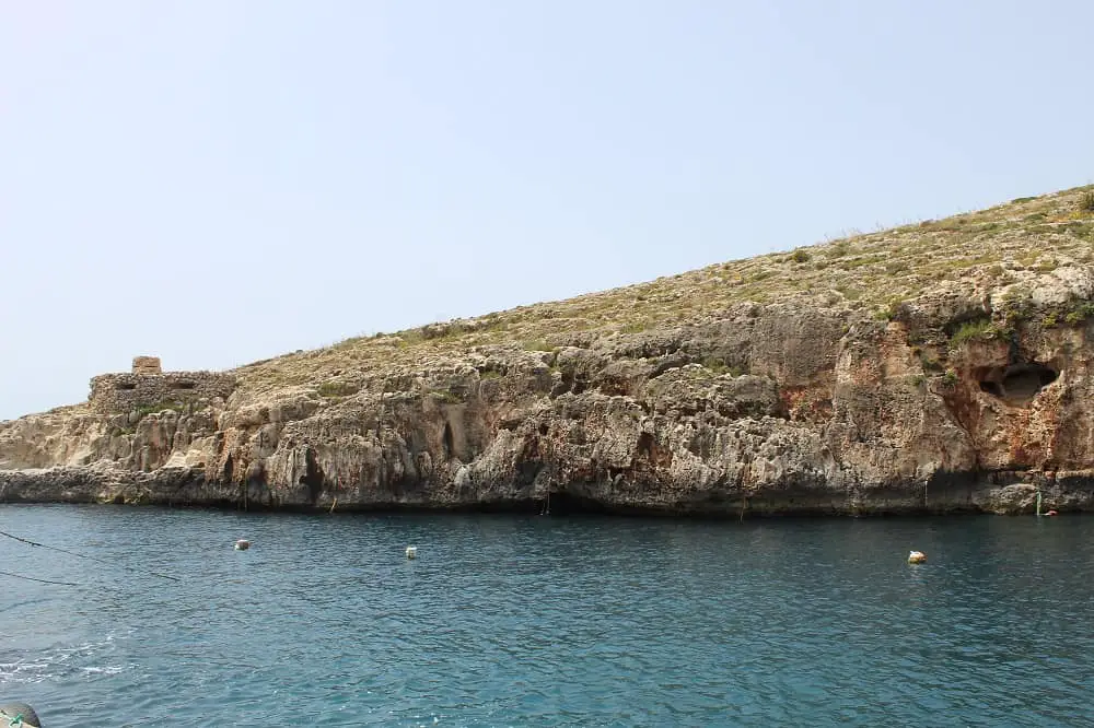 Malta in 3 days - rugged coastline seen from a boat.
