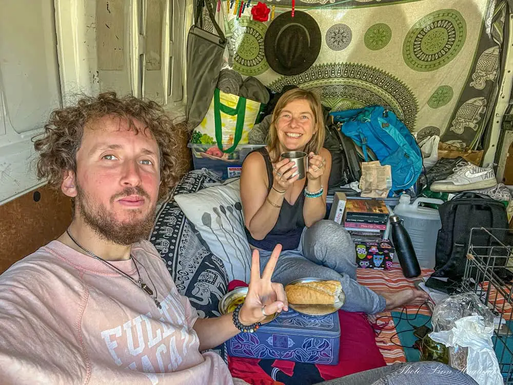 Mohammed and me having breakfast in our little living space while living in a camper Spain.