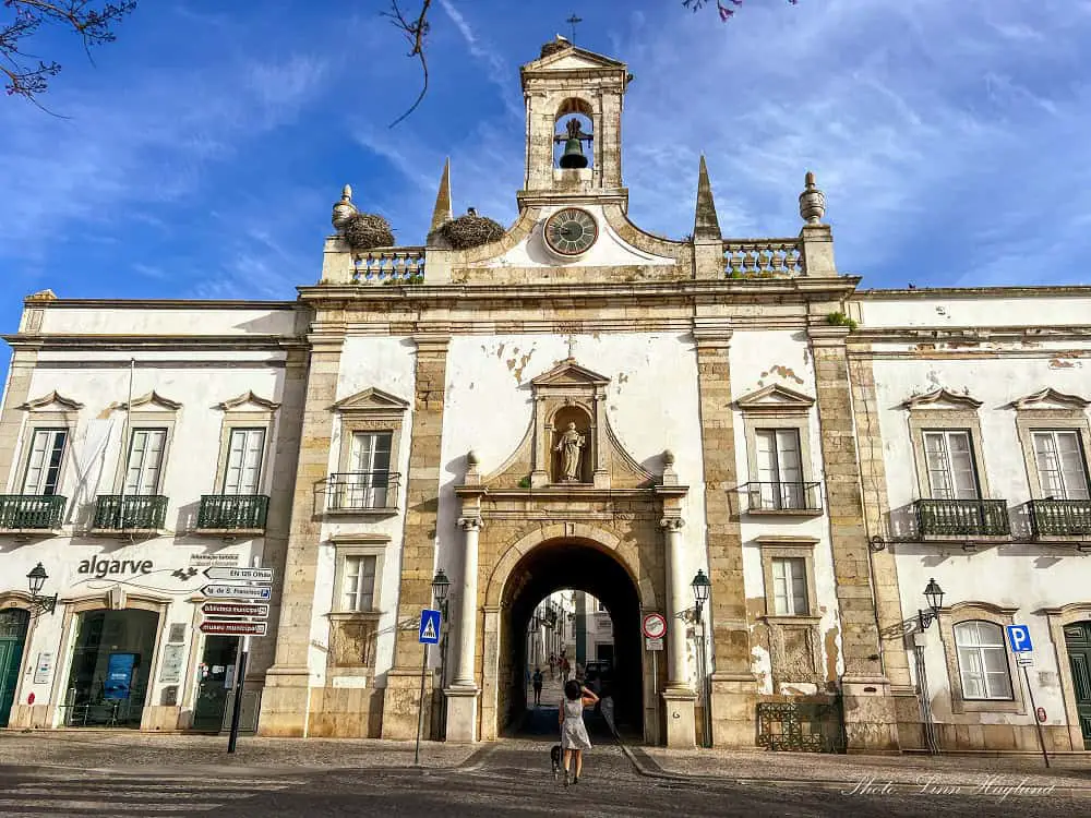 Me and Atlas walking through the beautiful gate, Arco de Vila in Faro Portugal.