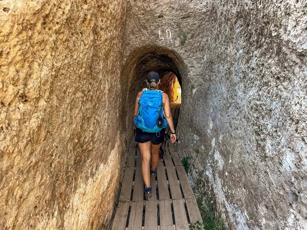 Me and Atlas walking through a tunnel in th emountain on one of the most epic hikes in Valencia.