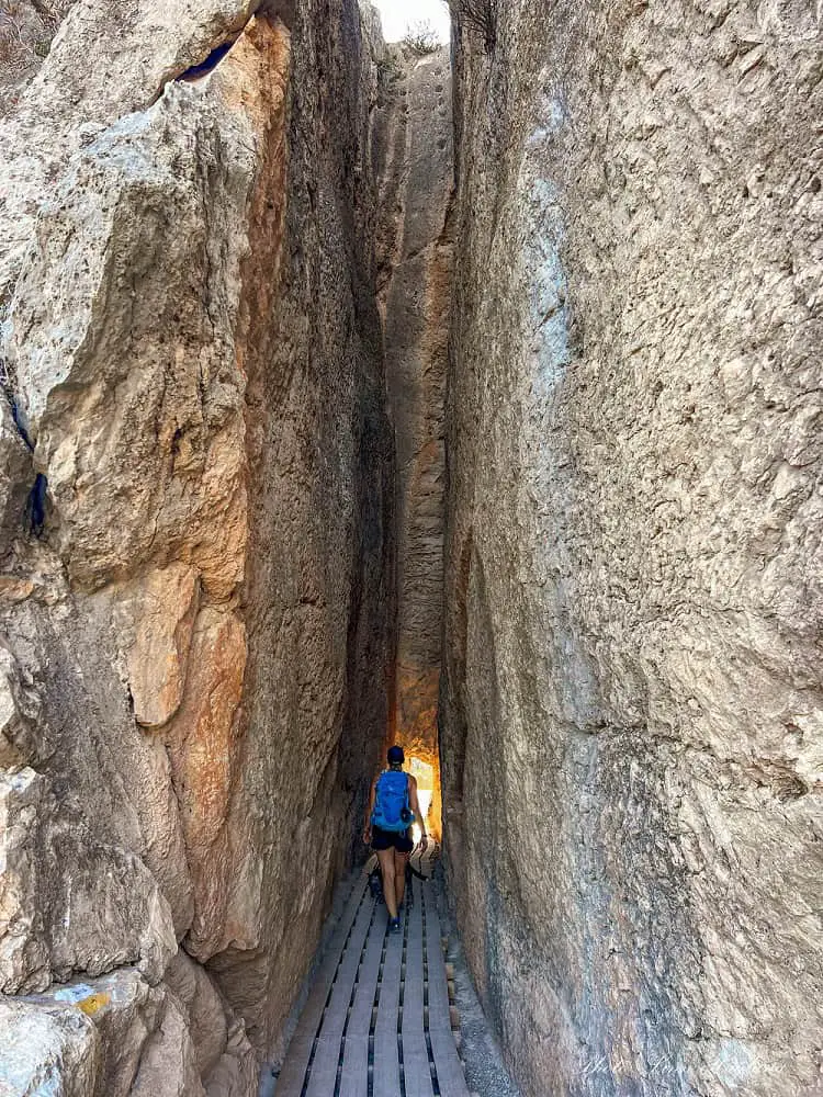 Hiking through a narrow tunnel in ghe mountains in Chelva Valencia.