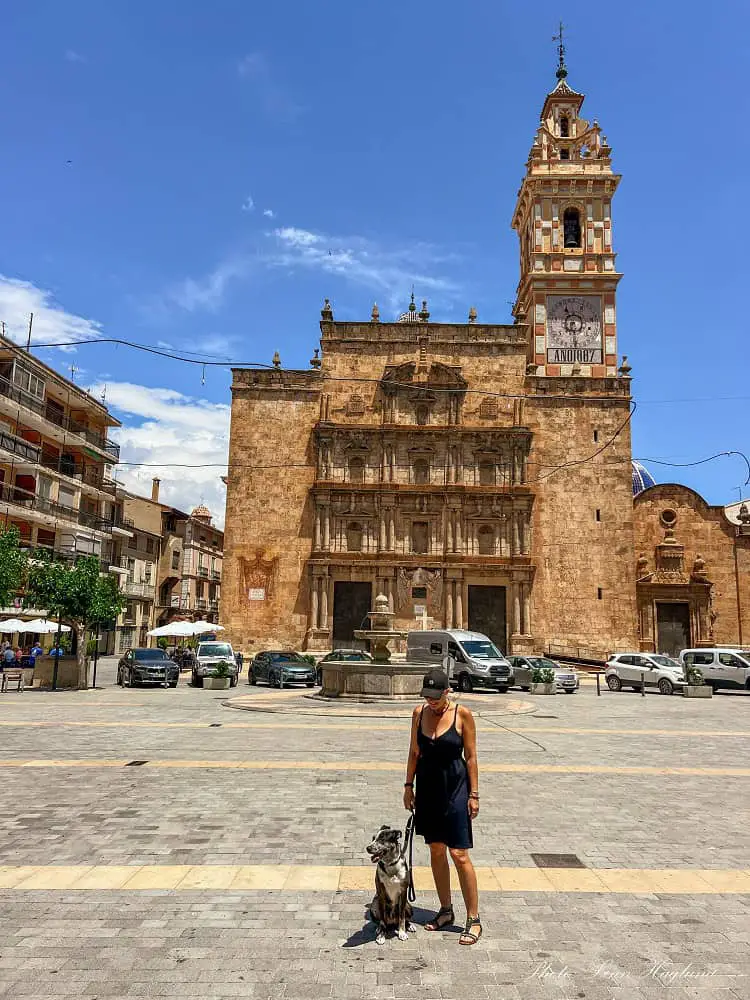 Me and Atlas in front of a medieval church on Plaza Mayor Chelva Valencia.