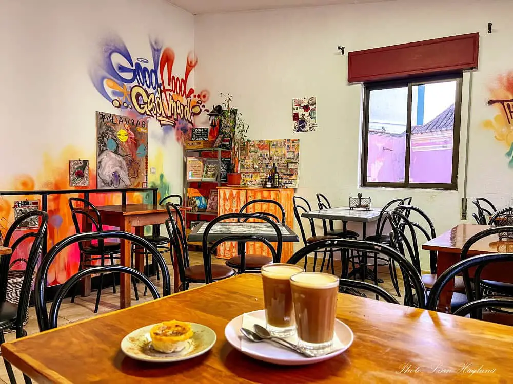 Having coffees and vegan pastel de nata in Vegan Box in Faro, Portugal.