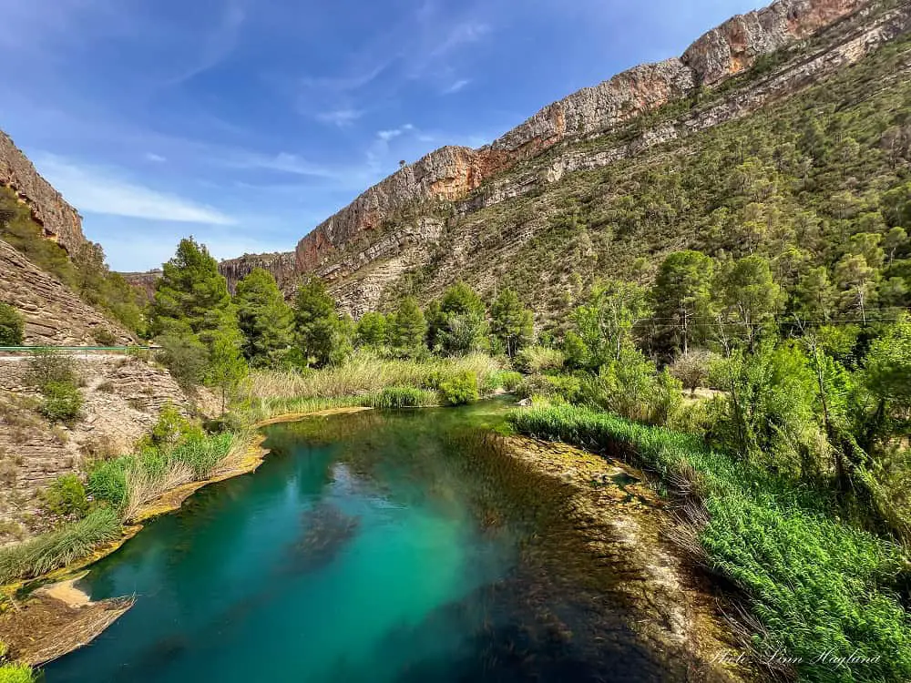 A turquoise lake between deep gorge walls in Ruta de los Pantaneros.