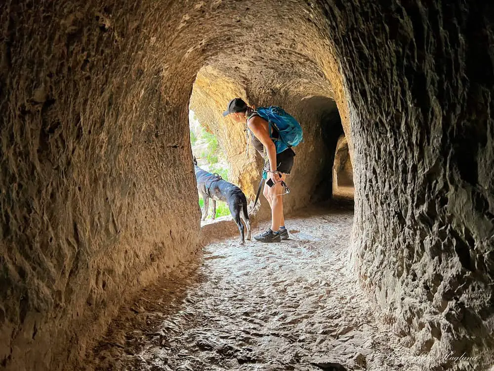 Me and Atlas looking out of a window in a tunnel in Ruta del Agua y Aqueducto de la Peña Cortada Chelva.