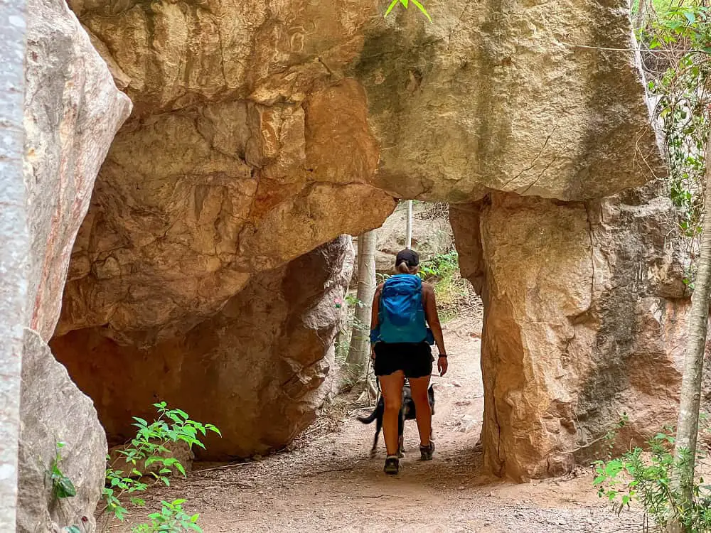 Me and Atlas walking through a natural arch.