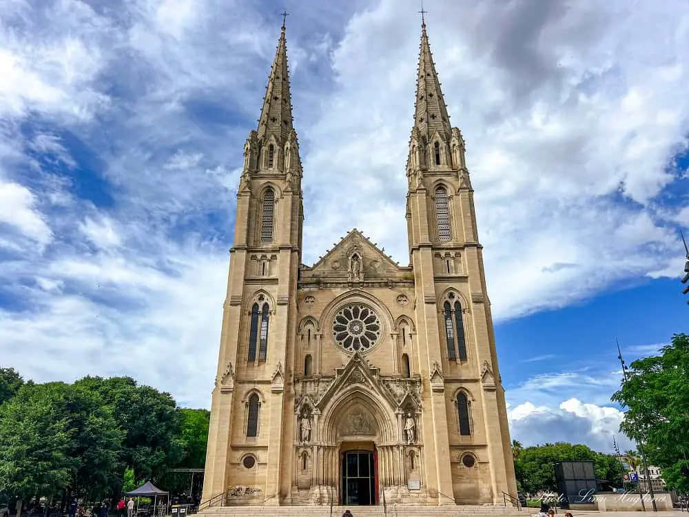 A beautiful Church in Nimes France with two large towers.