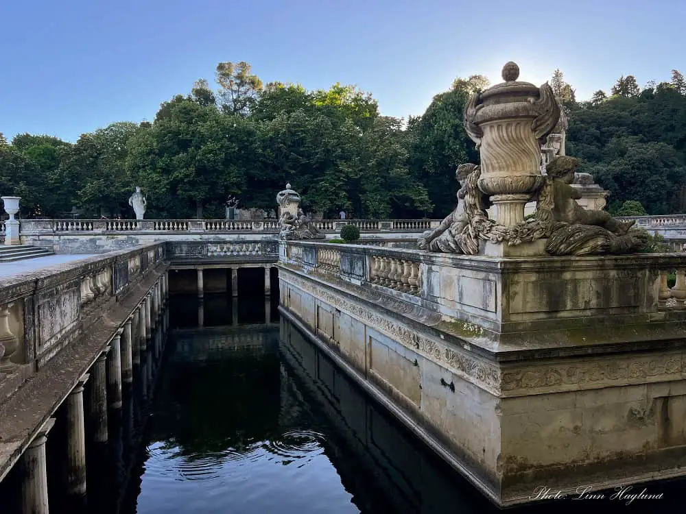 Statues in the large fountain in Jardin de la Fontaine in Nimes.