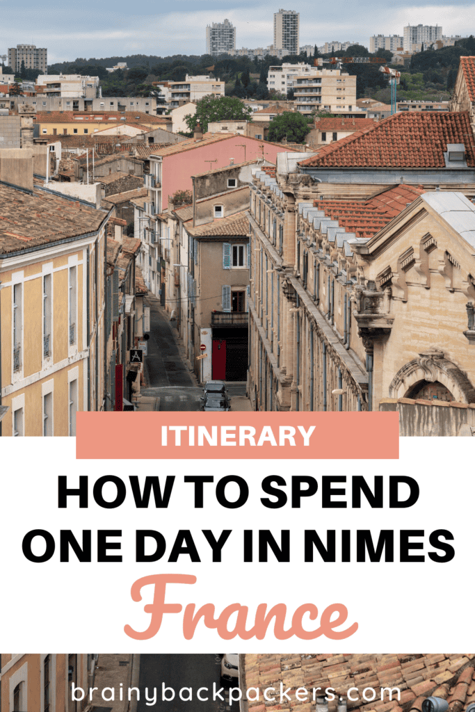 Pin design for Pinterest with an image of a street in Nimes and the text: "One Day in Nimes France Itinerary."