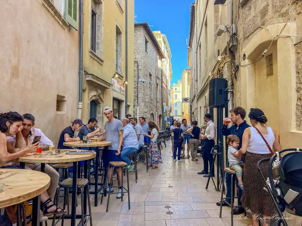 People having drinks when one day in Nimes France.