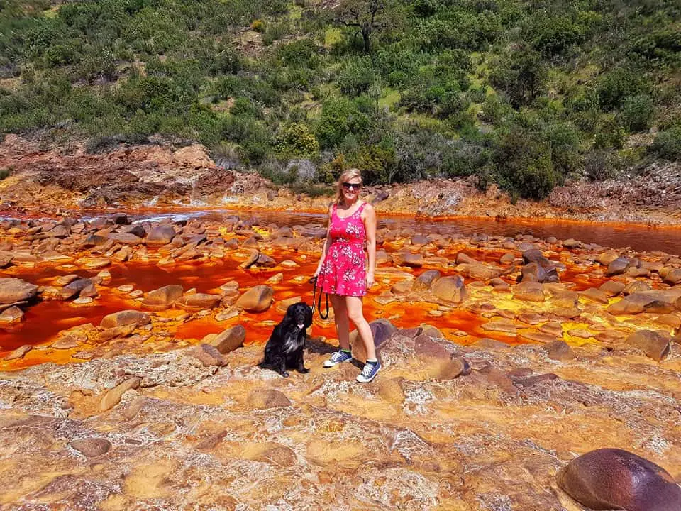 Me and my dog standing next to the red river,Rio Tinto in Huelva.