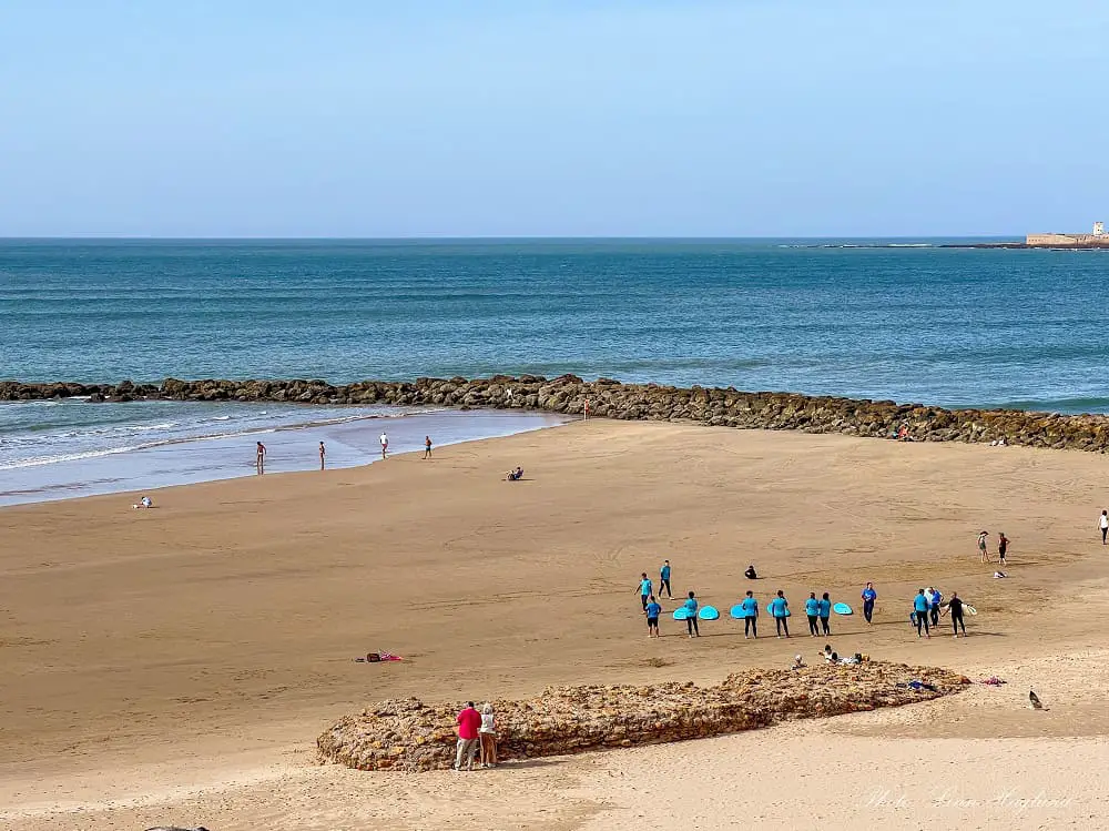 A group of surf students on the beach in Cadiz.