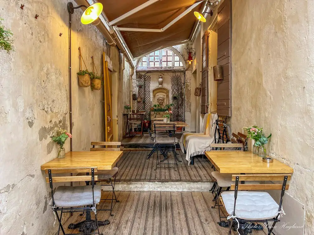 Cute restaurant in a hidden alley - one of the reasons to visit Arles France