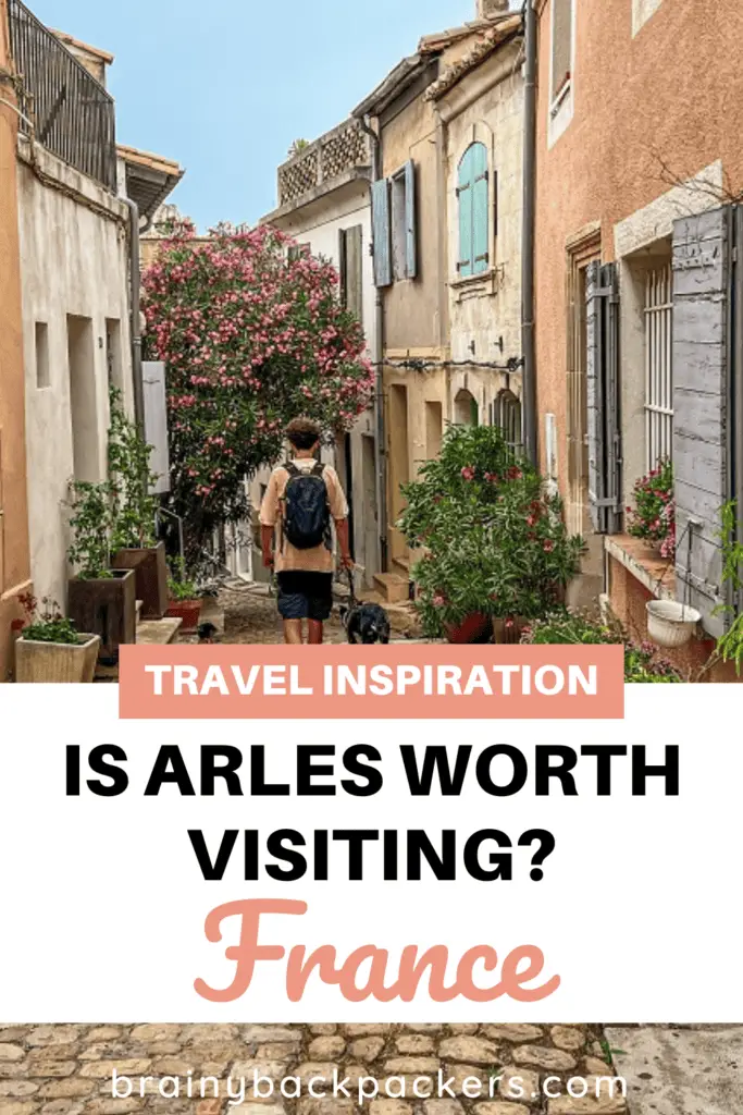 Design for Pinterest with a picture of a cute street with people walking and the text "Is Arles worth visiting?".