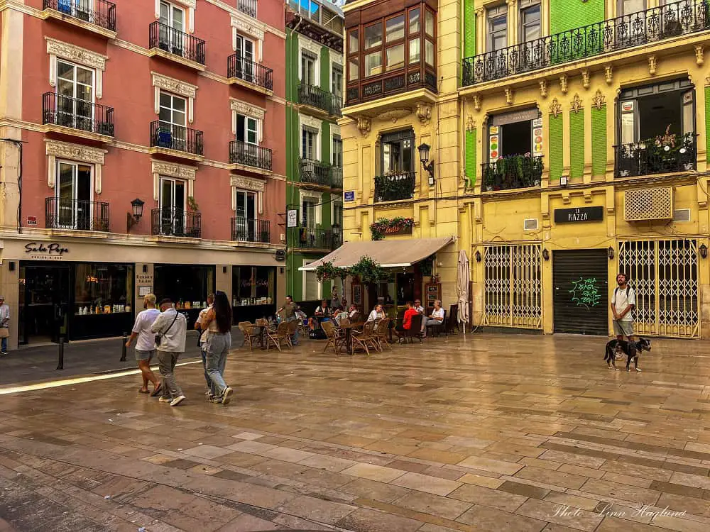 Is alicante worth visiting - pastel colored houses surrounding an old square