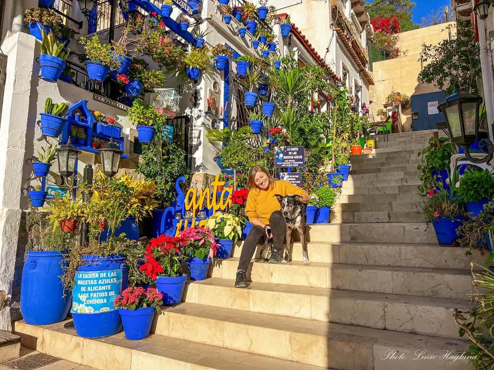 Me and Atlas outside a house with blue pot plants in the Santa Cruz neigborhood in Alicante.