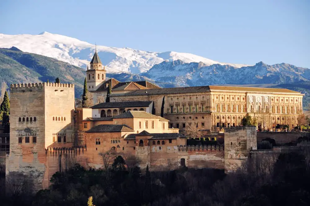 Snowcapped moutains behind the Alhambra palace in Granada in winter.