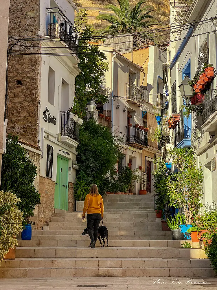 Me and Atlas walking around Santa Cruz neighborhood in Alicante during winter.