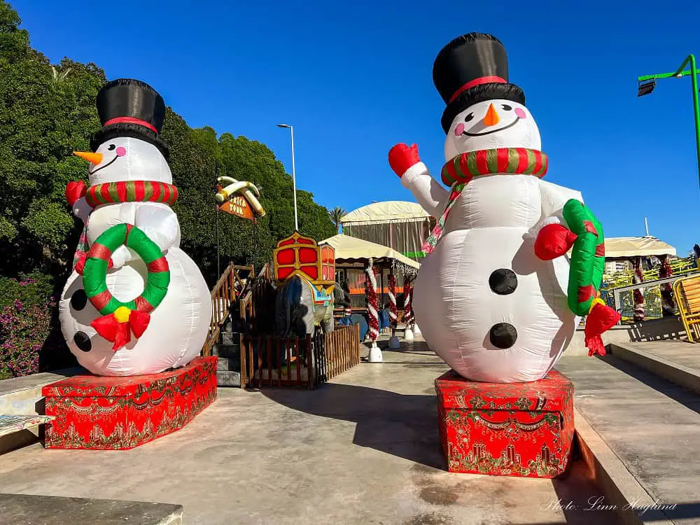 Two blow-up snowmen at the children's Christmas Village in winter in Alicante.