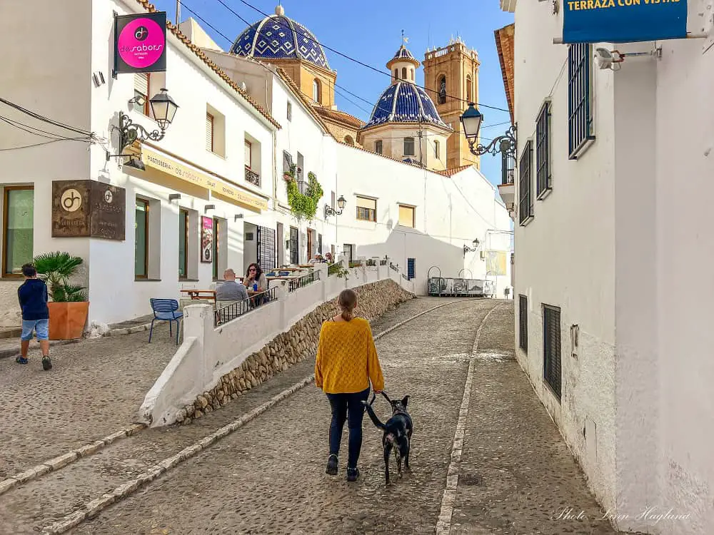 Me and Atlas walking in the streets of Altea - one of the best day trips from Alicante.