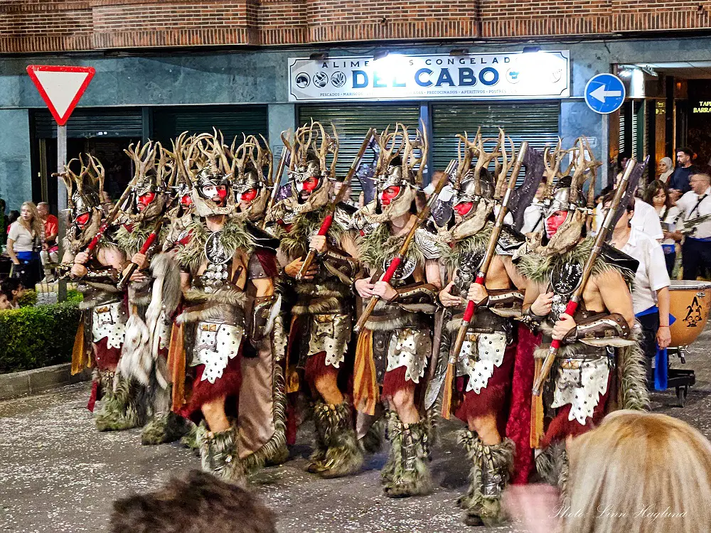 People dressed in Medieval warrior costumes at the Moros y Cristianos festival.