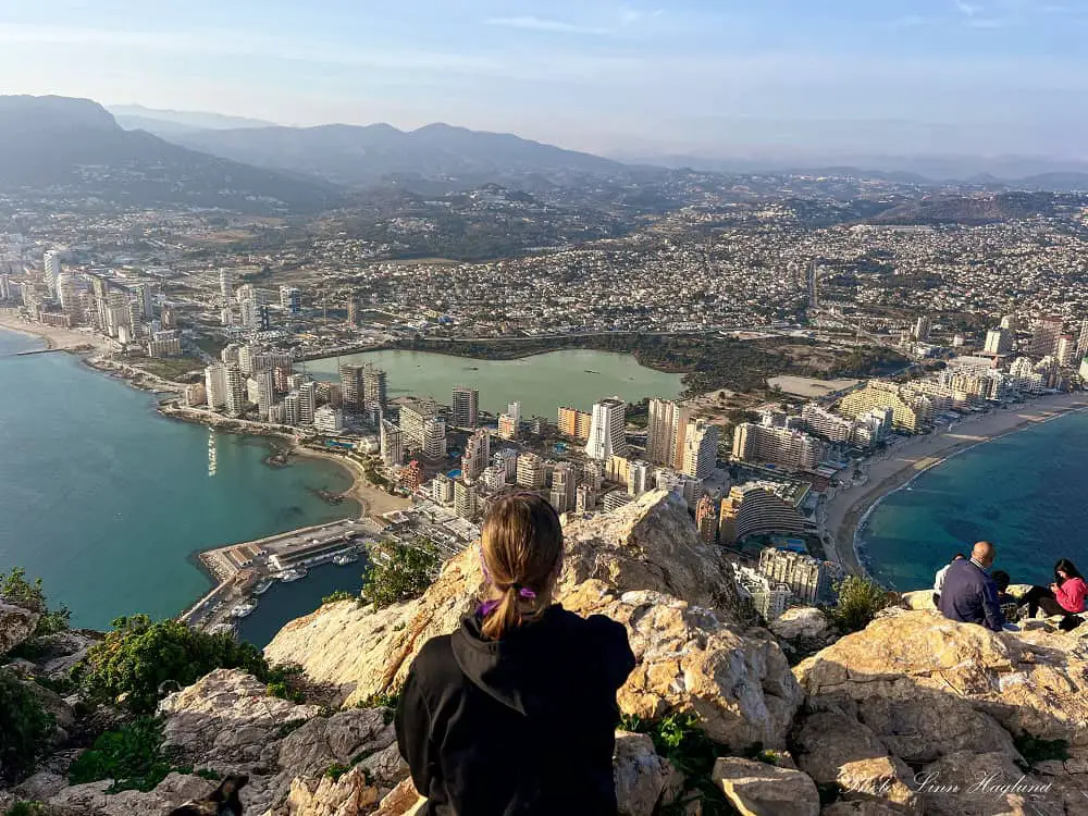 Views from Peñon de Ifach Calpe. Highrises along the coast of long beautiful beaches and turquoise coves and a lake in the middle of the buildings.