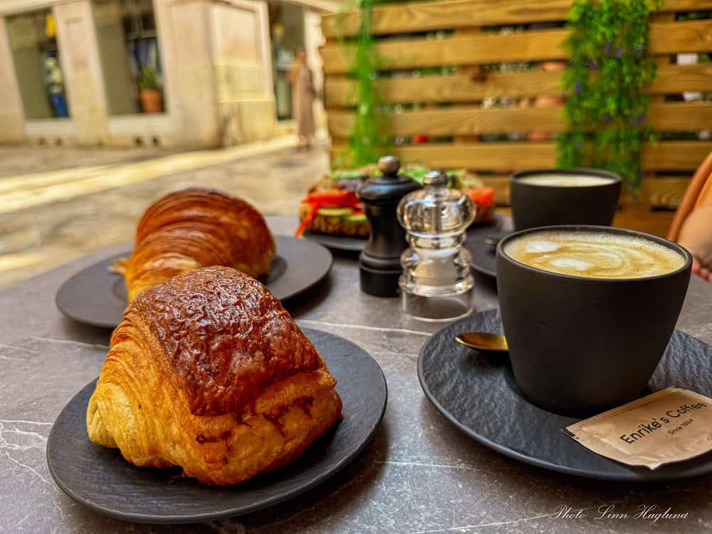 Brunch in Palma de Mallorca, with coffees, sandwiches and croissants.