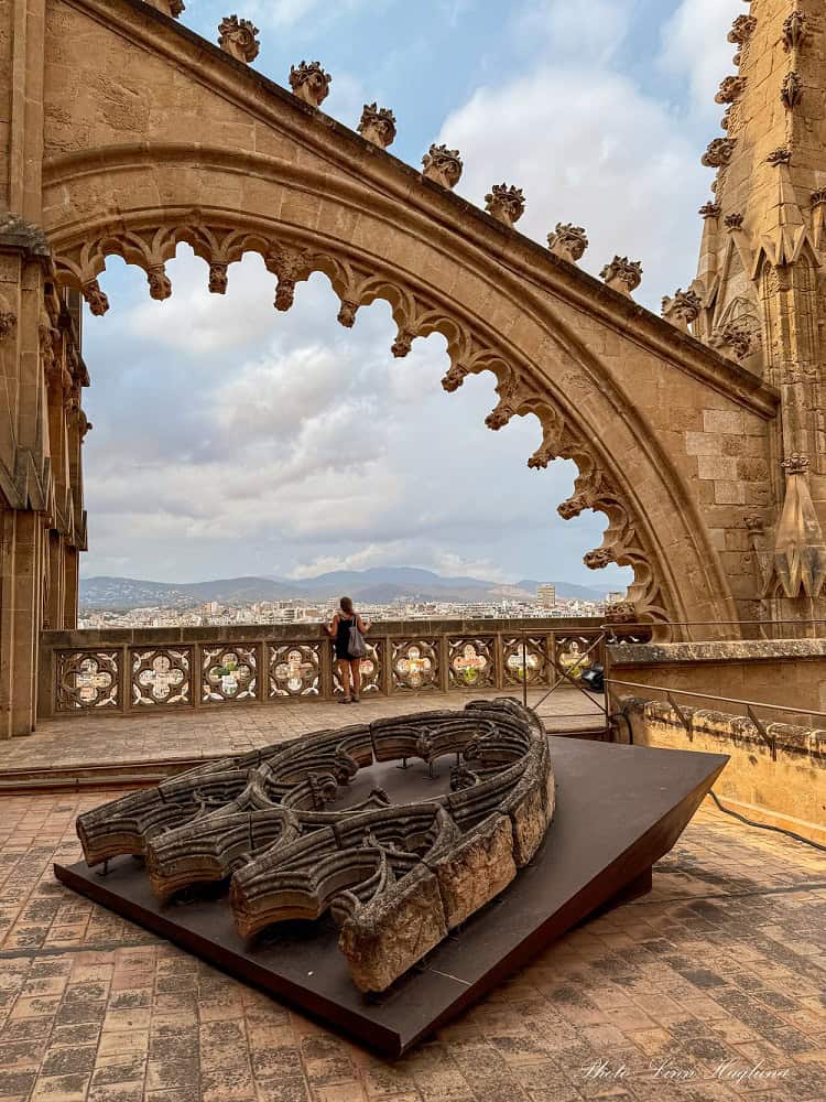 Me looking at the view from the rooftop of Palma Cathedral - a must-visit in 1 day in Palma de Mallorca.