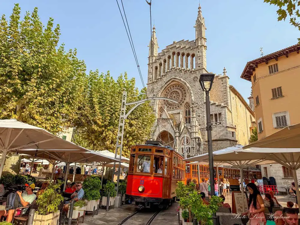 Tourists sitting on a historic tram which is among the best things to do in Soller.