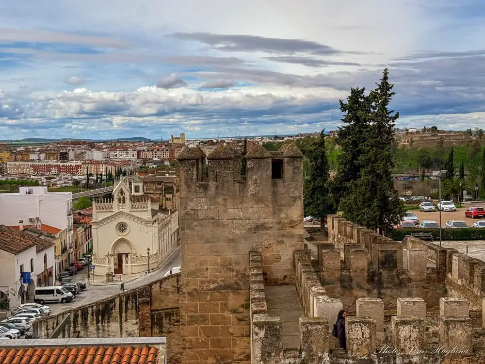 Walking on the ancient walls of the Alcazaba de Badajoz, which is one of the best things to do in Badajoz, Spain.